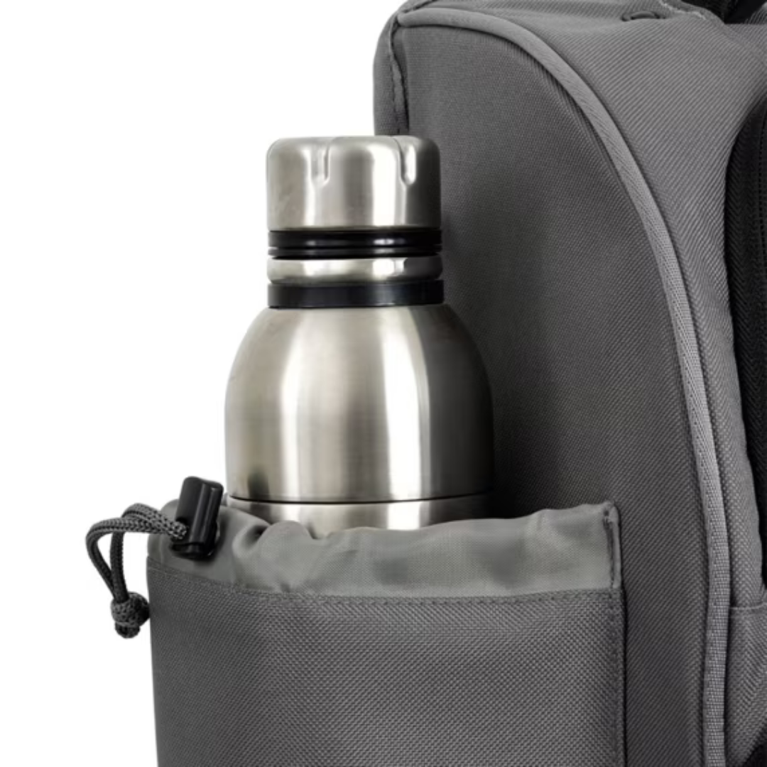 Side pocket of Shimano medium backpack holding a stainless steel bottle, highlighting its versatile storage options.